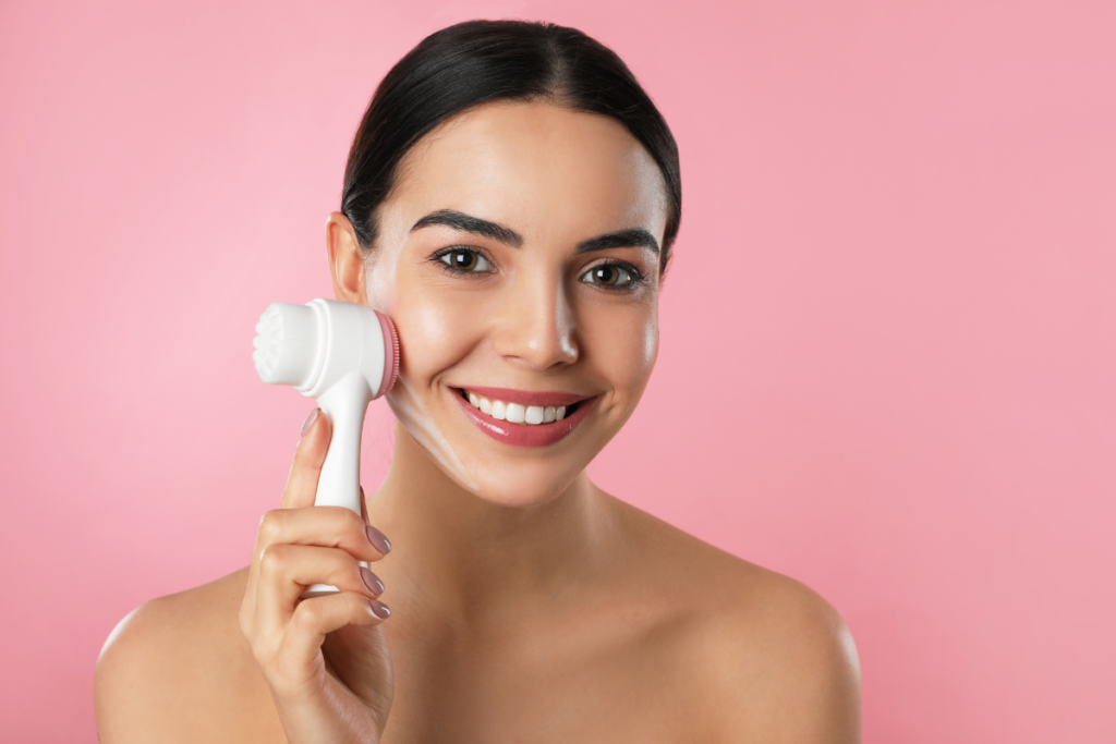 Woman using physical exfoliation on face