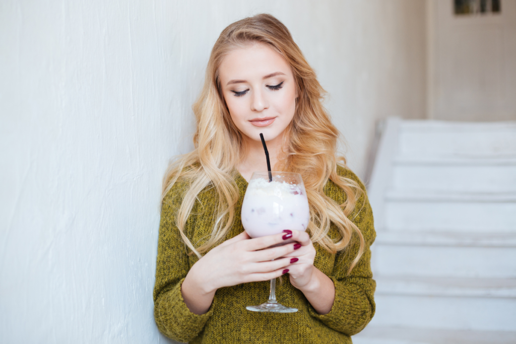 Beautiful woman enjoying fancy mocktail