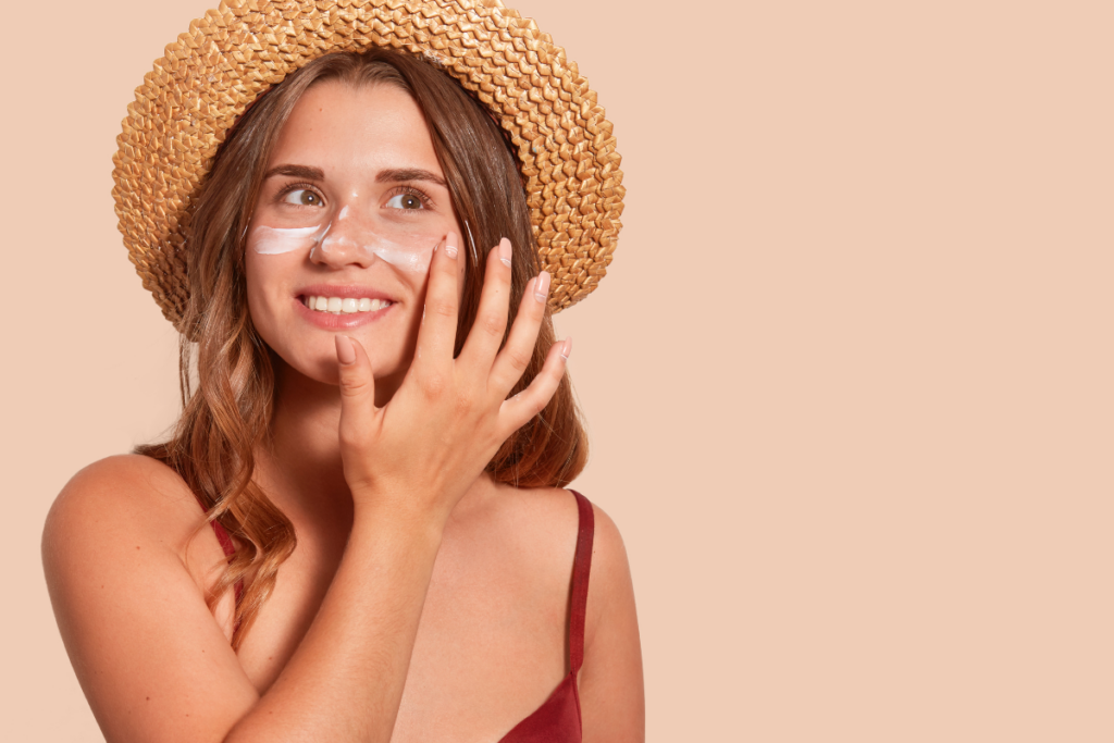 Woman putting sunscreen on face