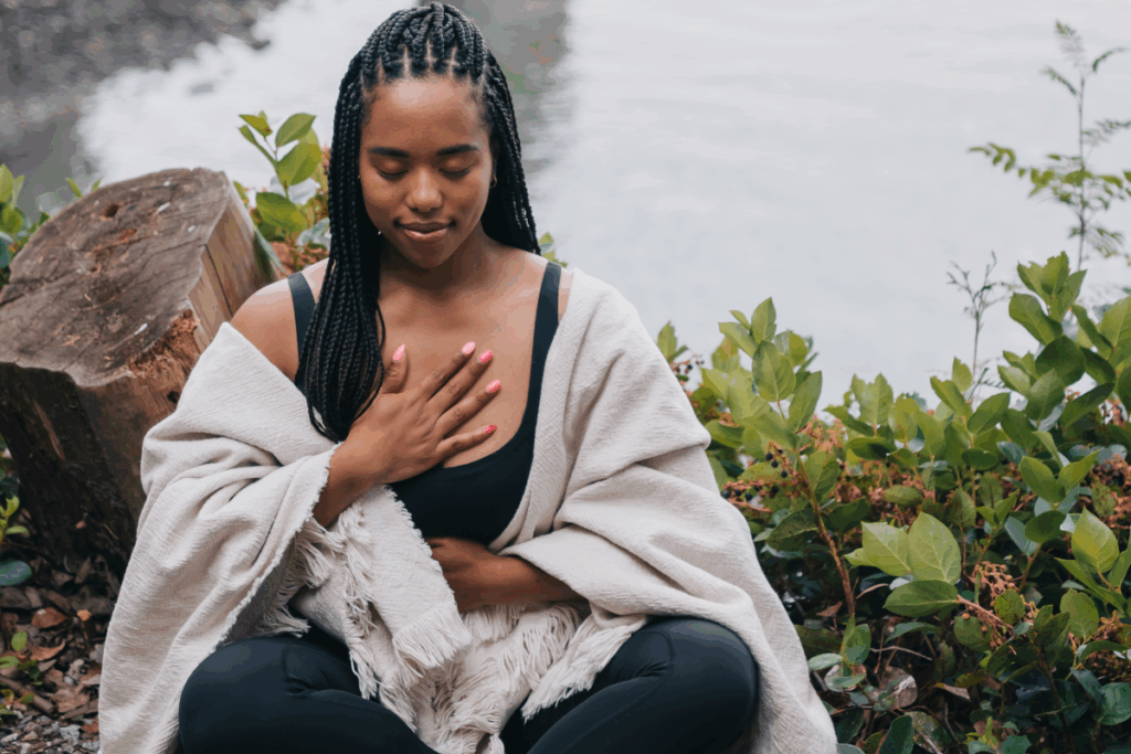 Woman sitting in nature while meditating