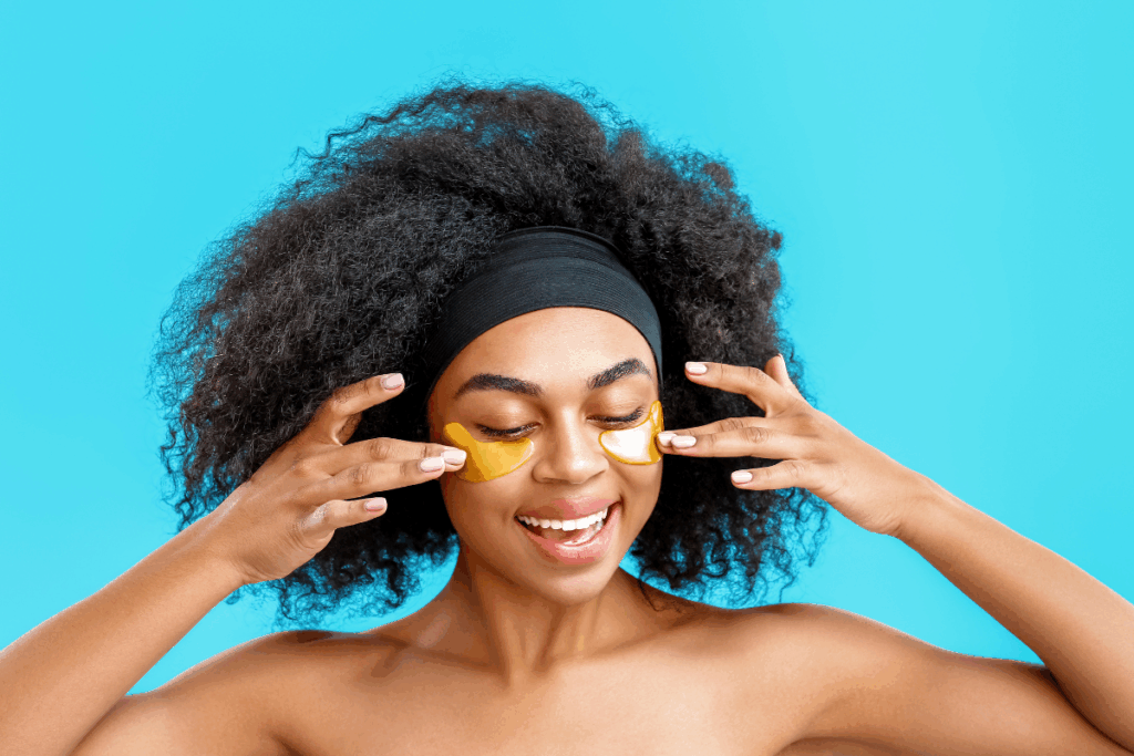 Woman using under eye patches